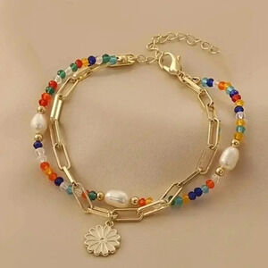 Gold Tone Two Strand Beaded Bracelet with adjustable length lobster clasp closur